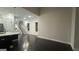An open-concept living area with dark hardwood floors, adjacent to the kitchen, and staircase at 1045 Kirkland Cir, Smyrna, GA 30080