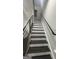 A staircase with dark treads and white risers, complemented by a black metal railing at 1045 Kirkland Cir, Smyrna, GA 30080