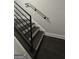 Modern staircase features dark wood steps, white risers, and sleek black metal railing at 1045 Kirkland Cir, Smyrna, GA 30080