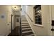 Bright stairway featuring dark stained treads, white risers and trim, and a window letting in natural light at 1045 Kirkland Cir, Smyrna, GA 30080