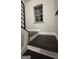 Staircase landing with dark wood flooring and trim, offering a bright and airy space at 1045 Kirkland Cir, Smyrna, GA 30080