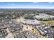 Expansive aerial shot featuring a residential area near a school and athletic fields, surrounded by trees at 1045 Kirkland Cir, Smyrna, GA 30080