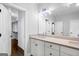 Bright bathroom boasting double sinks and vanity alongside a well organized walk in closet at 1045 Kirkland Cir, Smyrna, GA 30080