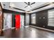 Bedroom showcasing dark walls, hardwood floors, recessed lighting, a modern ceiling fan, and a red door at 1045 Kirkland Cir, Smyrna, GA 30080