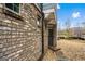 Brick facade of house featuring a window with shutters and nearby front entry at 1045 Kirkland Cir, Smyrna, GA 30080