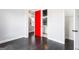Hallway view with red accent door leading to bath at 1045 Kirkland Cir, Smyrna, GA 30080
