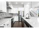 Bright kitchen with stainless steel appliances, center island, and modern backsplash at 1045 Kirkland Cir, Smyrna, GA 30080