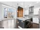 Open concept kitchen with stainless steel appliances, island, and adjacent living area at 1045 Kirkland Cir, Smyrna, GA 30080