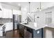 Modern kitchen with white cabinets, stainless steel appliances and large central island at 1045 Kirkland Cir, Smyrna, GA 30080