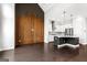 Open-concept living space showcasing dark wood floors and custom wood accent wall at 1045 Kirkland Cir, Smyrna, GA 30080