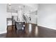 Open concept living space adjacent to kitchen and stairs at 1045 Kirkland Cir, Smyrna, GA 30080