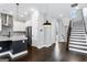 Open-concept living space with kitchen, staircase, and modern design elements at 1045 Kirkland Cir, Smyrna, GA 30080