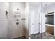 Walk-in shower featuring grey tile and bronze fixtures creating a modern and luxurious feel at 1045 Kirkland Cir, Smyrna, GA 30080