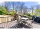 Outdoor deck with table and chairs, perfect for entertaining and enjoying backyard views at 2840 Riverfront Dr, Snellville, GA 30039