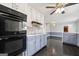 Bright kitchen with stainless appliances, backsplash, and a view into another room at 2840 Riverfront Dr, Snellville, GA 30039