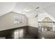 Open loft area featuring hardwood floors, neutral walls, natural light and views of the living room at 2840 Riverfront Dr, Snellville, GA 30039