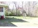 Backyard view with lawn and treeline at 6064 Monica Dr, Morrow, GA 30260