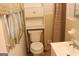Bathroom with built in shelving and window with shade at 6064 Monica Dr, Morrow, GA 30260