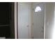Bright entryway with a white front door with a decorative window and a coat closet at 6064 Monica Dr, Morrow, GA 30260