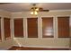 Sun-drenched room featuring walls of windows, wood flooring, and natural light at 6064 Monica Dr, Morrow, GA 30260