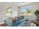 Bright dining room with large windows and a modern glass table at 217 Crystal Ct, Hampton, GA 30228