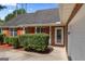 Charming brick home with red shutters, neatly manicured bushes, and an inviting front entrance at 217 Crystal Ct, Hampton, GA 30228