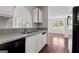 Bright kitchen featuring stainless steel sink and views of the dining room at 217 Crystal Ct, Hampton, GA 30228