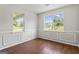 Bright room features chair rail, hardwood floors and two large windows offering ample natural light at 217 Crystal Ct, Hampton, GA 30228