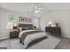 Relaxing main bedroom featuring a ceiling fan and natural lighting from two large windows at 217 Crystal Ct, Hampton, GA 30228