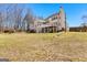 Spacious backyard featuring a well-maintained lawn, perfect for outdoor activities and entertaining at 821 Hood Rd, Fayetteville, GA 30214