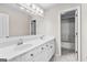 Bathroom boasts a double sink vanity, updated fixtures, and doorway to the bath and shower at 821 Hood Rd, Fayetteville, GA 30214