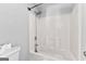 Full bath with a tub and shower combination and white tiling at 821 Hood Rd, Fayetteville, GA 30214