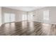Expansive bonus room with plenty of natural light and modern flooring at 821 Hood Rd, Fayetteville, GA 30214