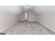 Large bonus room featuring plush carpeting, neutral paint and access to hallways and doors at 821 Hood Rd, Fayetteville, GA 30214