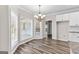 Inviting dining area offers ample natural light and modern lighting fixture at 821 Hood Rd, Fayetteville, GA 30214