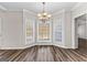Bright breakfast nook featuring a bay window and stylish chandelier at 821 Hood Rd, Fayetteville, GA 30214