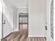 Bright foyer with hardwood floors and a glimpse of the spacious living area beyond at 821 Hood Rd, Fayetteville, GA 30214