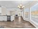 Open living space with modern flooring, stainless steel appliances, and an airy atmosphere at 821 Hood Rd, Fayetteville, GA 30214
