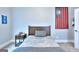 Bedroom with a wooden headboard, a patriotic flag on the wall, and a side table at 1080 Gaithers Rd, Mansfield, GA 30055