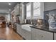 Modern kitchen showcasing stainless steel appliances, custom cabinetry, a farmhouse sink, and sleek countertops at 1110 Blair Ln, Peachtree City, GA 30269