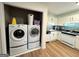 Convenient laundry area adjacent to the kitchen with washer and dryer included at 142 Kylee Ct, Villa Rica, GA 30180