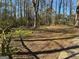 Large backyard featuring mature trees at 6625 Paula Ct, Lithonia, GA 30038