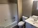 Bathroom featuring a tub, toilet, and vanity with neutral colors at 6625 Paula Ct, Lithonia, GA 30038