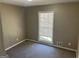 Comfortable bedroom featuring carpeted floors, neutral walls, and a bright window at 6625 Paula Ct, Lithonia, GA 30038