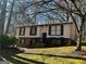 Charming home with light siding, black shutters, and a well-maintained lawn at 6625 Paula Ct, Lithonia, GA 30038