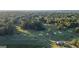 Scenic aerial view capturing the lush green fairways of the golf course surrounded by dense woodlands at 1278 Heritage Dr, Villa Rica, GA 30180