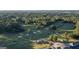Breathtaking aerial view of the golf course with rolling greens and a clubhouse, surrounded by lush forest at 1278 Heritage Dr, Villa Rica, GA 30180