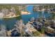 Enjoy an aerial view of the home on a waterfront lot with mature trees at 1278 Heritage Dr, Villa Rica, GA 30180