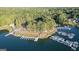 Overhead view of a lakeside community, showcasing a private marina and lush tree coverage, offering an exclusive waterfront lifestyle at 1278 Heritage Dr, Villa Rica, GA 30180