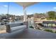 Outdoor seating on a covered porch with lake views at 1278 Heritage Dr, Villa Rica, GA 30180
